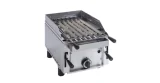 Simple tabletop gas barbecue for volcanic rock with a splash guard